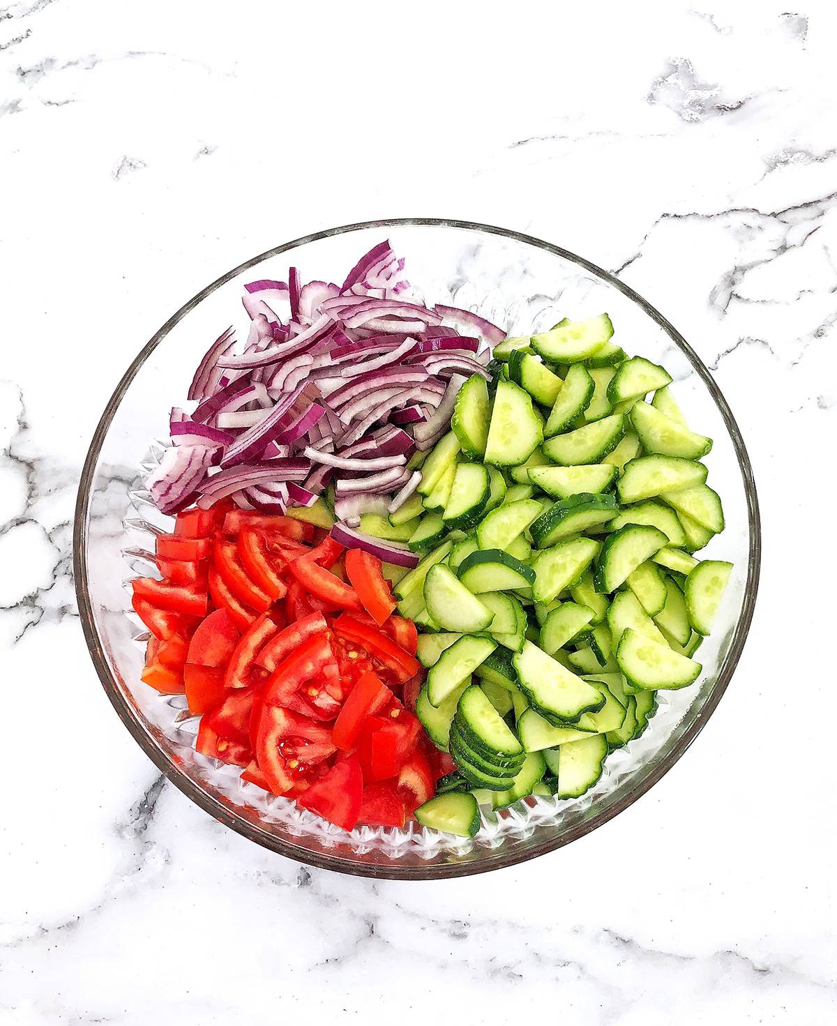 Start by rinsing and slicing vegetables and placing them into a large bowl.
