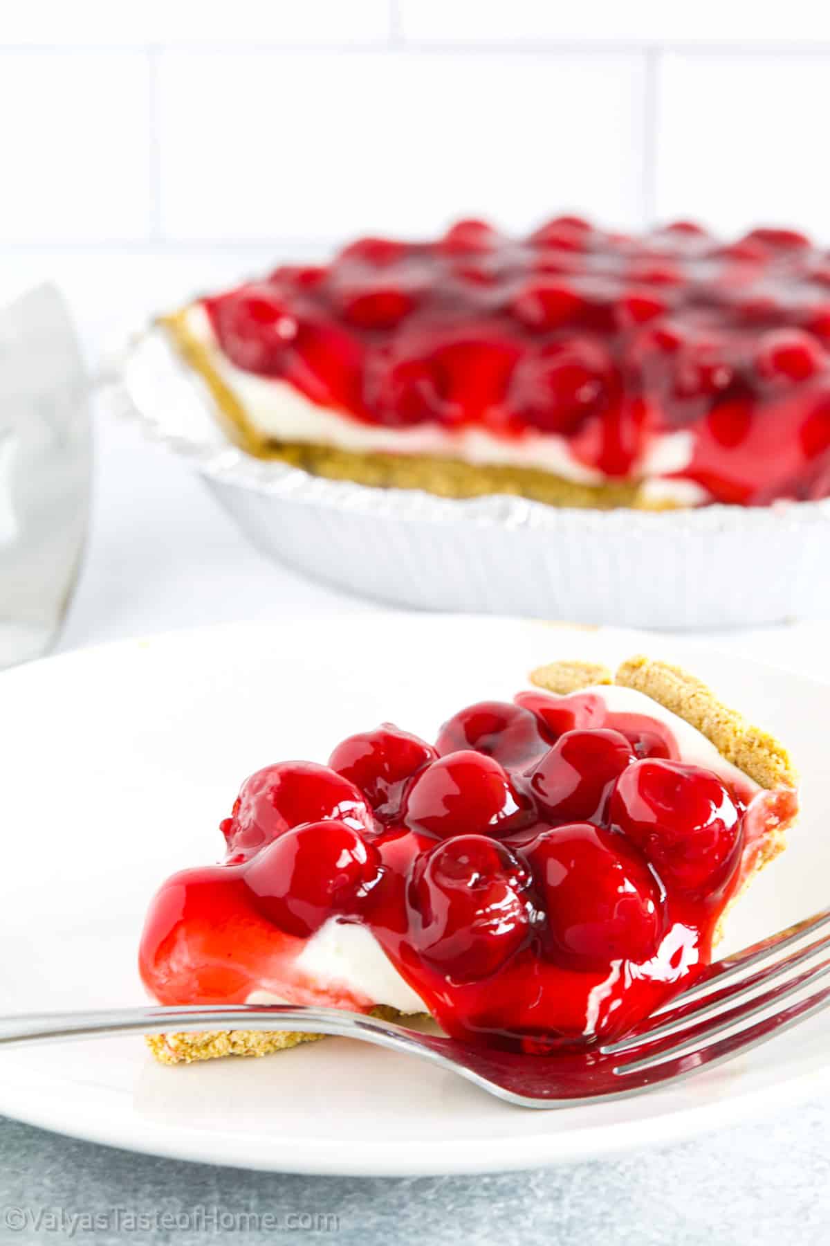 This dessert features the most delicious crust that perfectly complements the creamy and tangy cheese filling, while the sweet cherry topping adds a burst of flavor and color. 