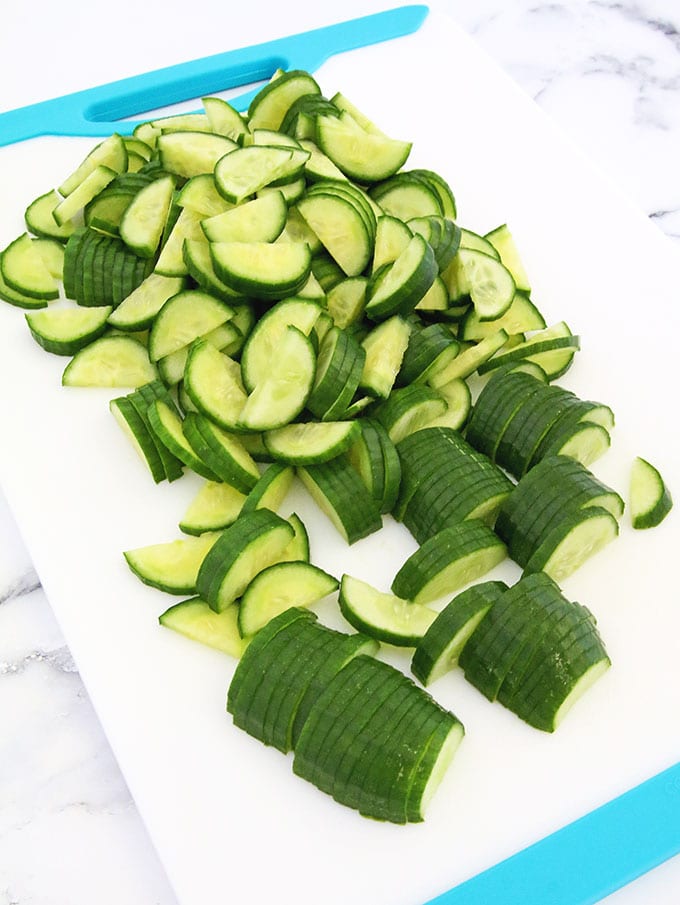 Rinse and slice cucumbers.