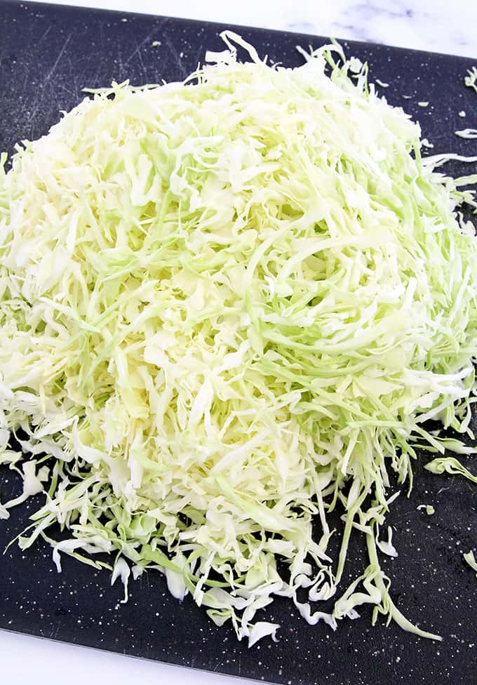 Rinse and shred one whole small head of cabbage. 