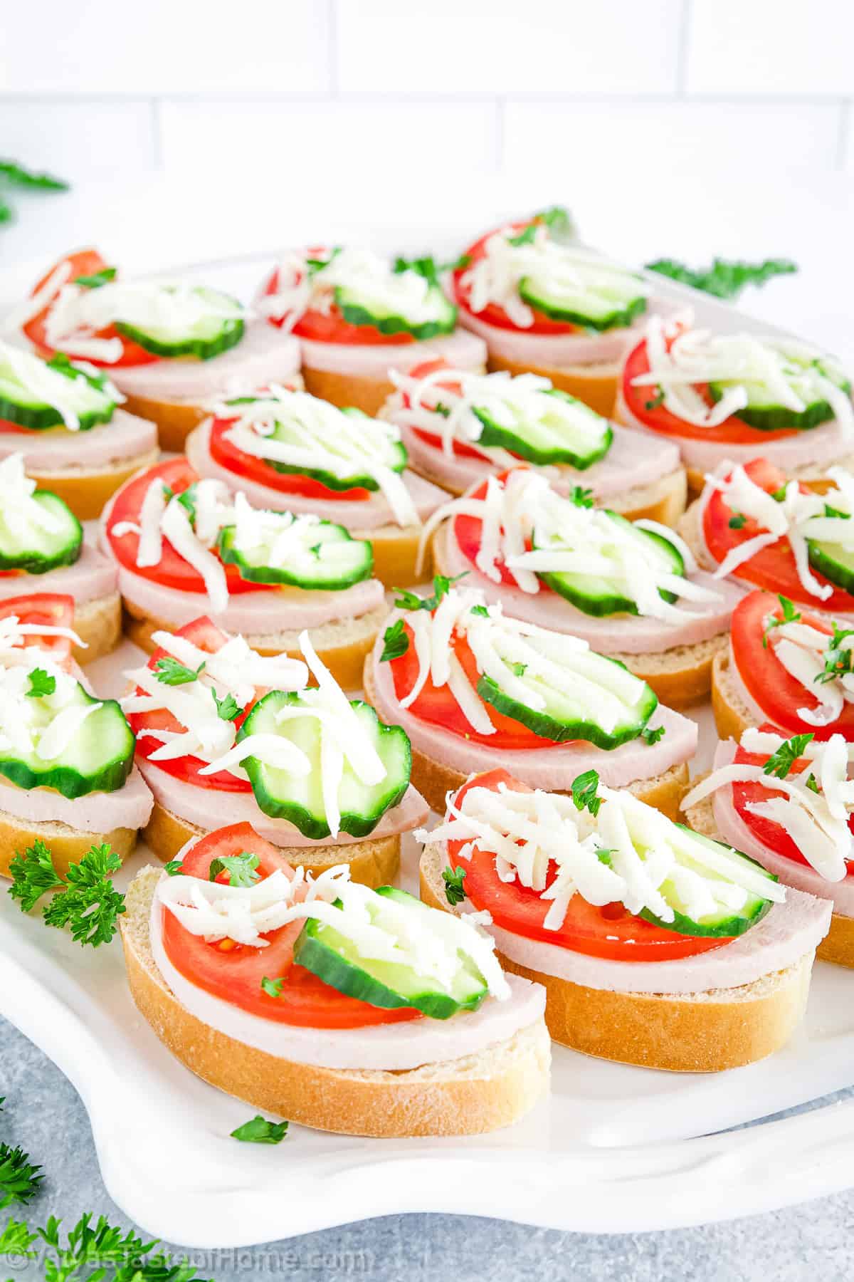 The combination of fresh cucumbers, tomatoes, bologna, and mozzarella cheese is incredibly flavorful and satisfying.