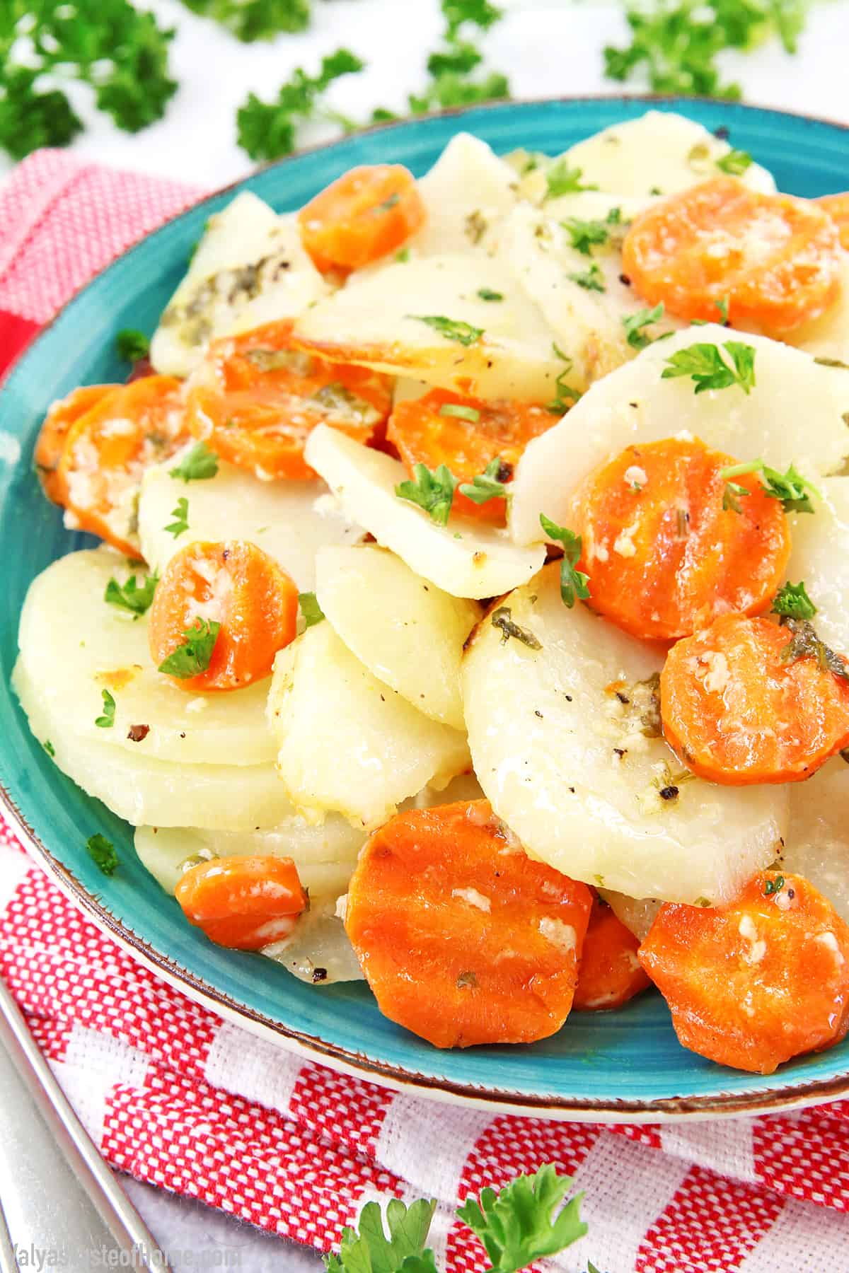 For the love... of potatoes! Scalloped potatoes feature thinly sliced potatoes baked in the oven. This Scalloped Potatoes with Carrots recipe is my modified lighter, quicker version that we make for weeknight dinners. But it also suits the holiday table as well.