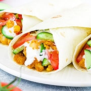 Breakfast tacos are a popular Mexican-American breakfast dish that typically includes scrambled eggs, chorizo, potatoes, and a variety of toppings such as salsa, cucumbers, tomatoes, avocado, sour cream, and bacon or sausage.
