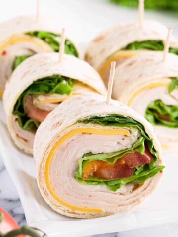 These Turkey Pinwheel Appetizers are great, and healthy snacks loaded with vitamins, protein, fiber, and low in fat. Plus, it’s a chance to get some veggies in, such as green leaf lettuce and tomato.