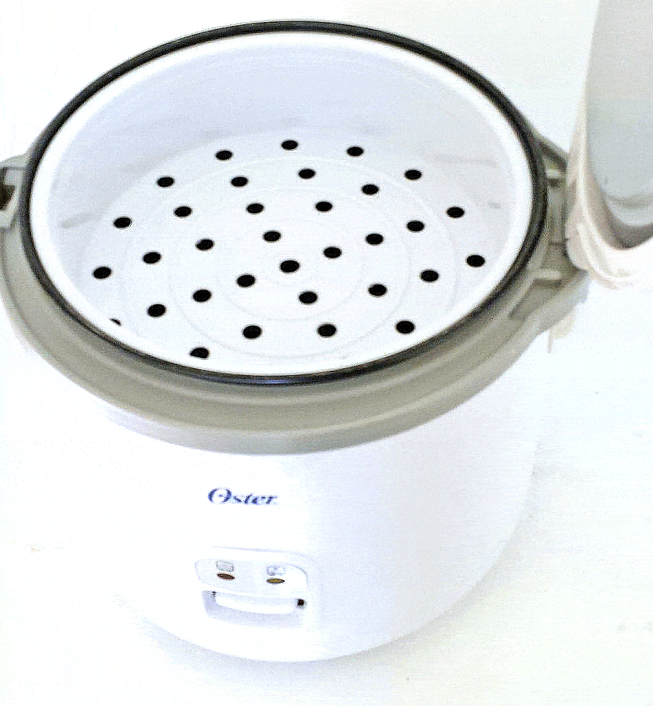 The rice cooker is used to steam the broccoli to a crisp tender.