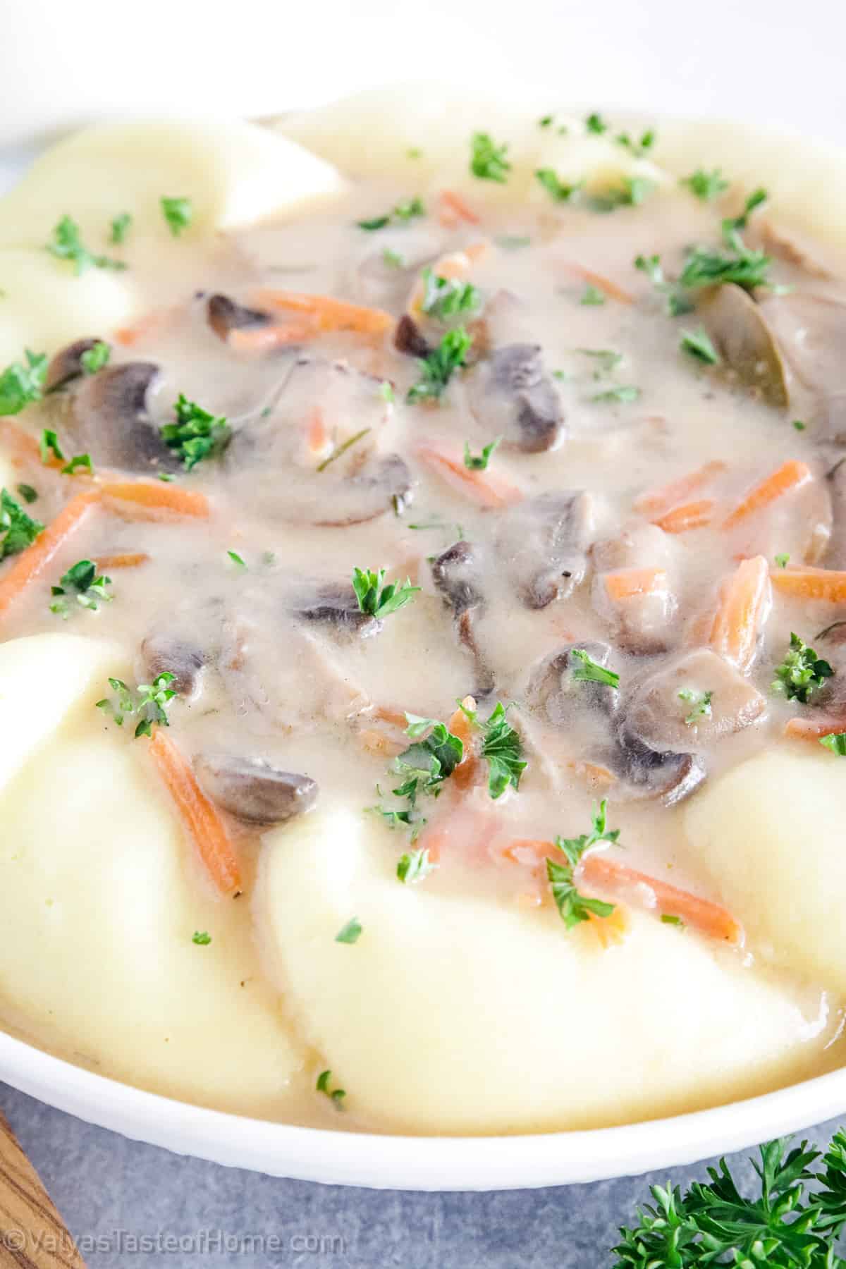 Mushroom gravy is a savory sauce usually made with mushrooms, broth or bouillon, and seasonings. It's very delicious as a topping for mashed potatoes, but also goes great on steak and other beef, roast chicken, pork, and even vegetables!
