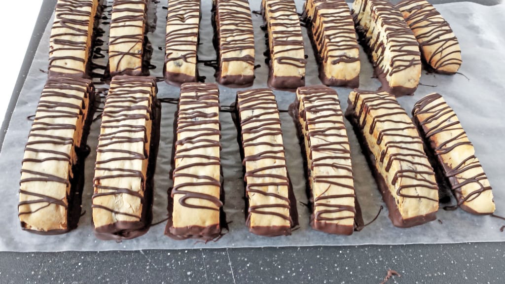 Finally, remove your biscotti from the fridge and carefully peel them off the wax paper.