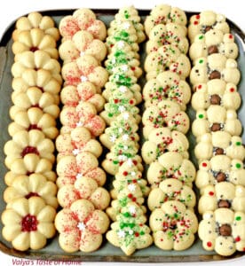 What holiday would dessert plate be complete without these incredible Christmas Spritz Cookies? These may be the most popular, classic Christmas cookies you'll ever make. I have been making these Spritz cookies for years and they've become a traditional Christmas cookie recipe in our family.