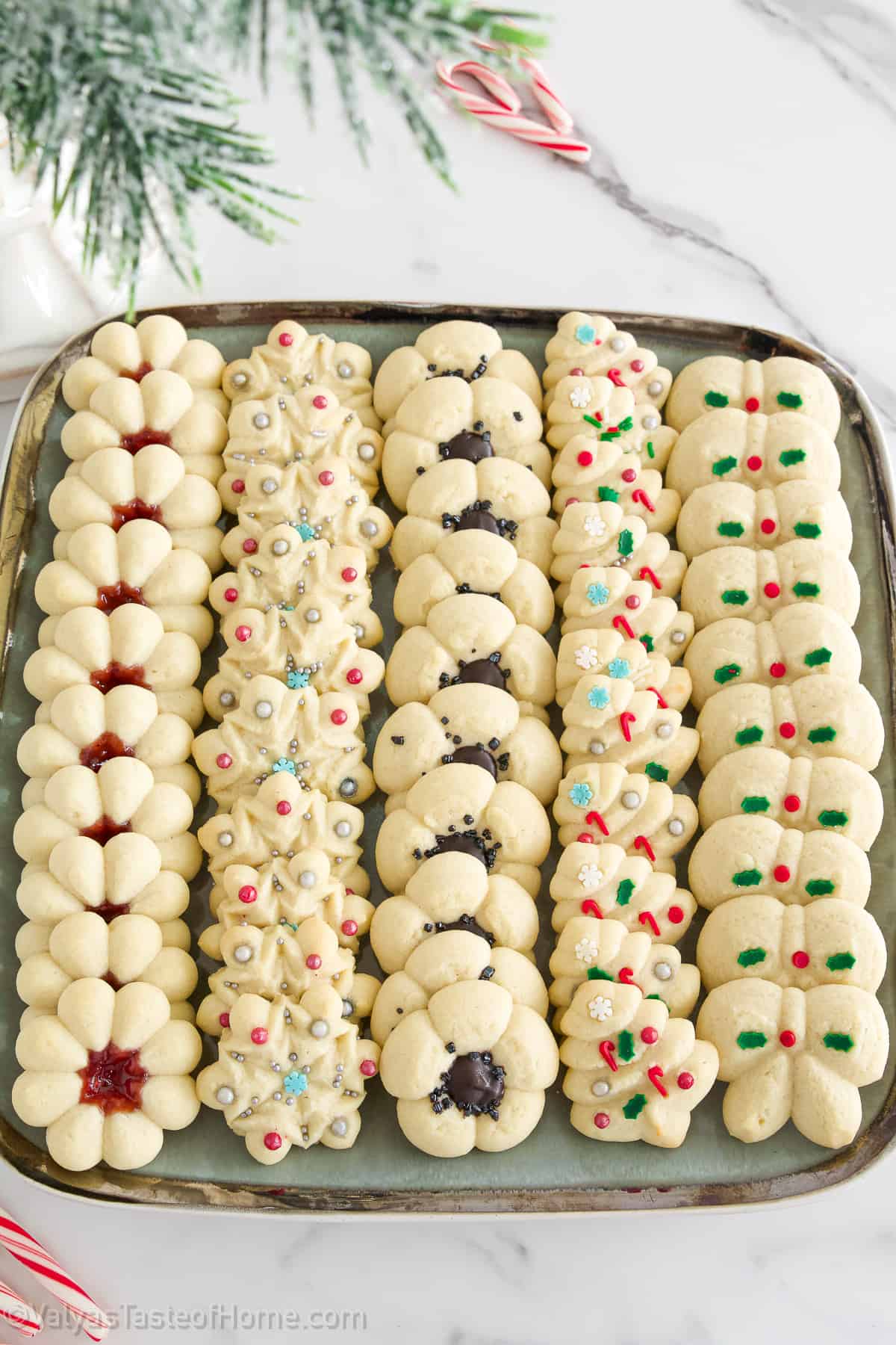 This Christmas Cookies recipe (Spritz Cookies) will give you classic and delicious flavors easily at home! With festive shapes and decor these are bound to win everyone's heart!