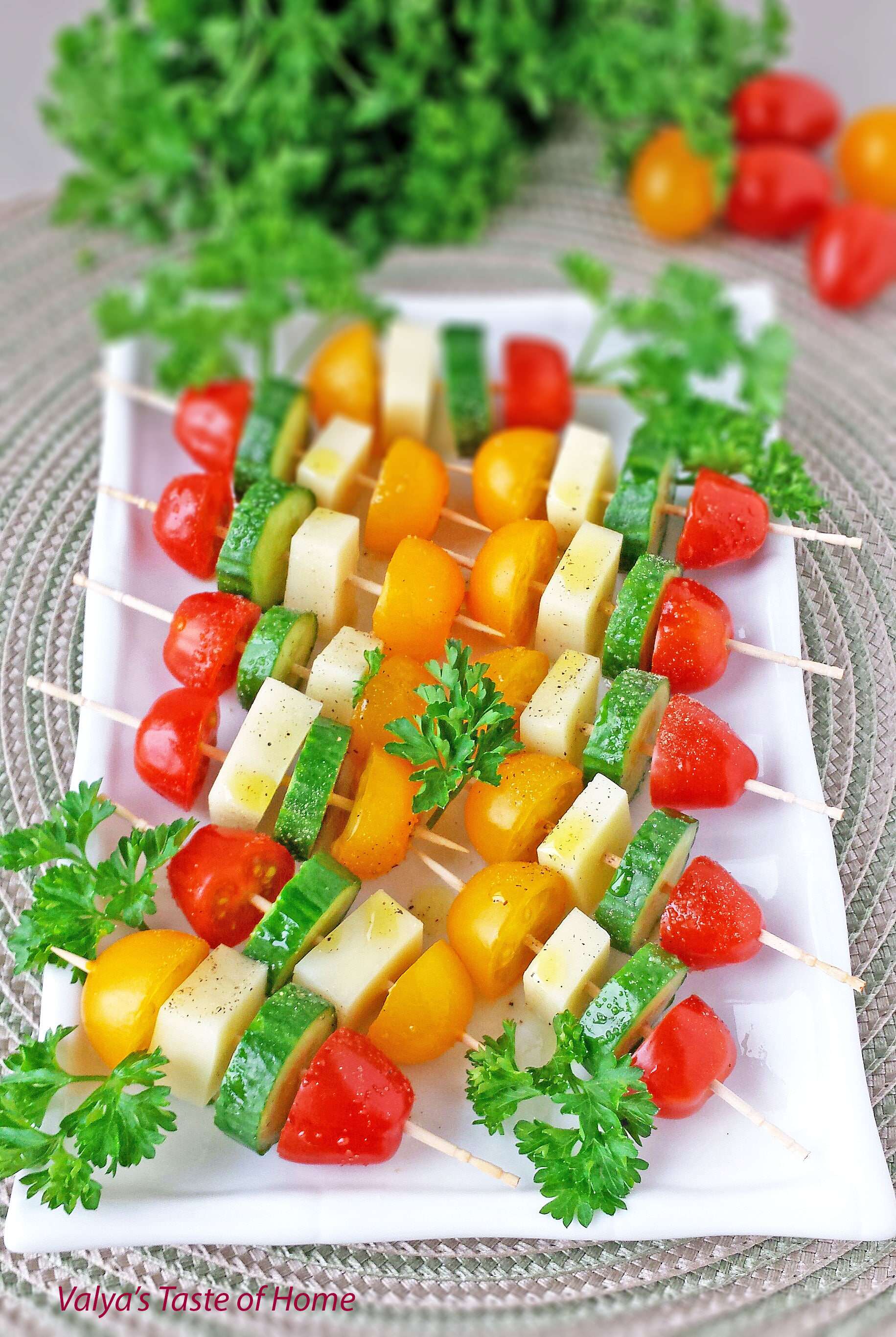 These delightful and healthy Tomatoes Cucumber and Mozzarella Cheese Kabob Appetizers seasoned with salt and pepper, and drizzled in olive oil are so easy to make and tastes absolutely delicious. #kabobappetizers #veggiekabobappetizers #partyfriendly #valyastasteofhome