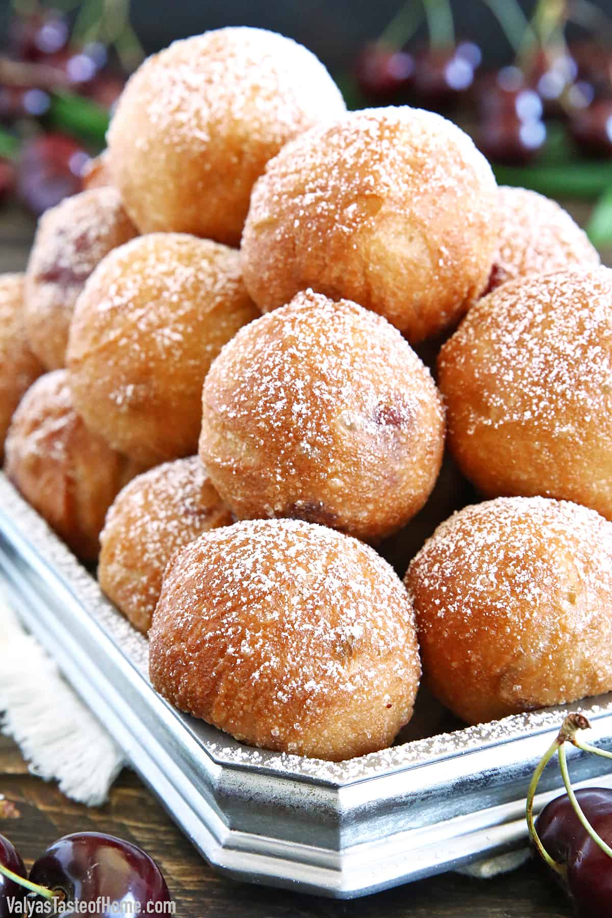 Ponchiki are delicious donut holes that are a beloved treat in Russia and Ukraine and are known for their soft, fluffy texture and burst of sweet cherry goodness.