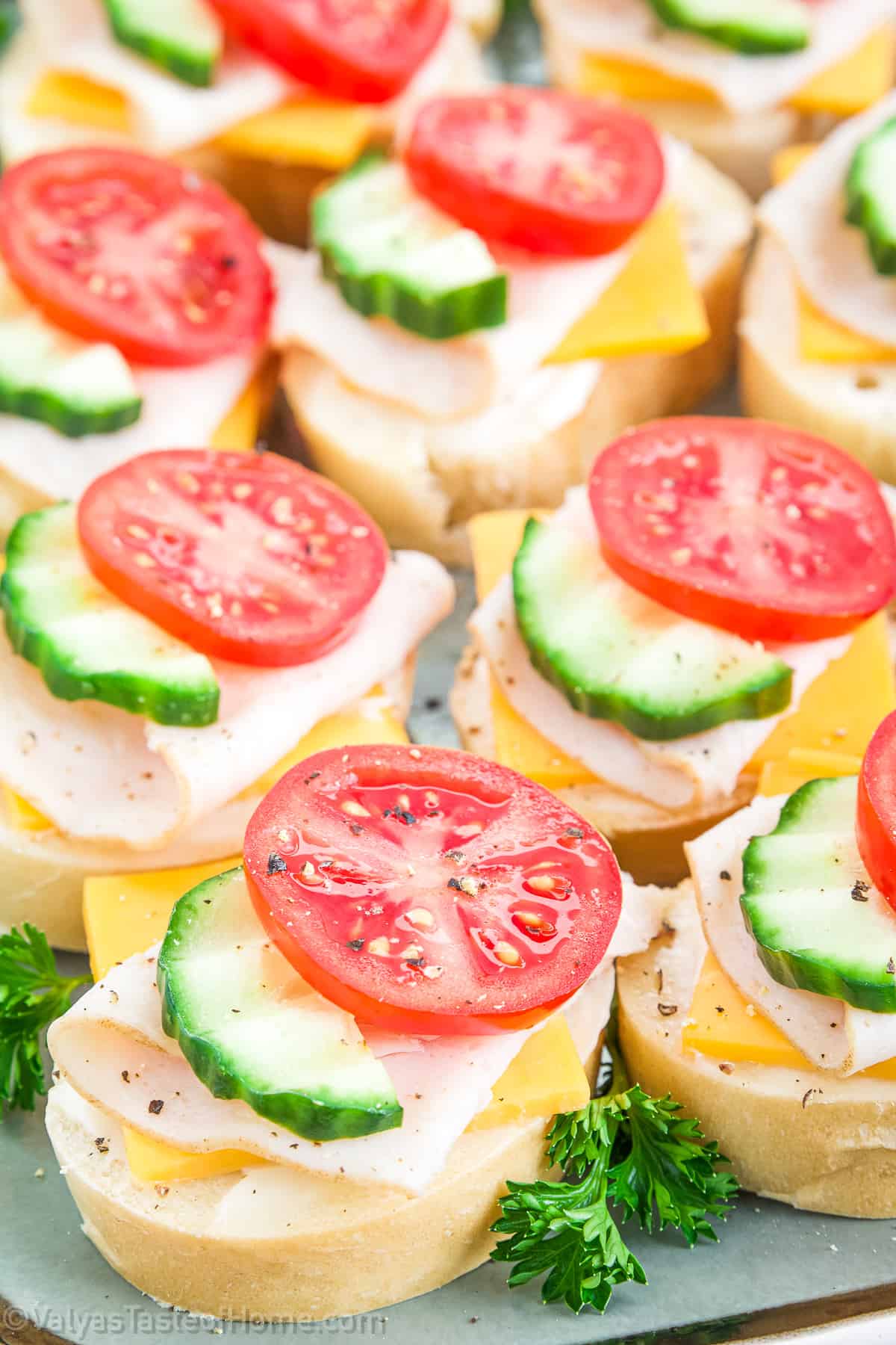These appetizers showcase classic flavor combinations that are sure to please everyone. The smoked turkey, fresh cucumbers, and tangy tomatoes are always a hit.
