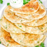 These delicious, savory cheburеki are best served hot, with a side of sour cream. Enjoy the authentic flavors and comforting warmth of this traditional dish.