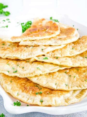 Cheburеki (Чебуреки) are fried meat dumplings or meat turnovers that are absolutely delicious!