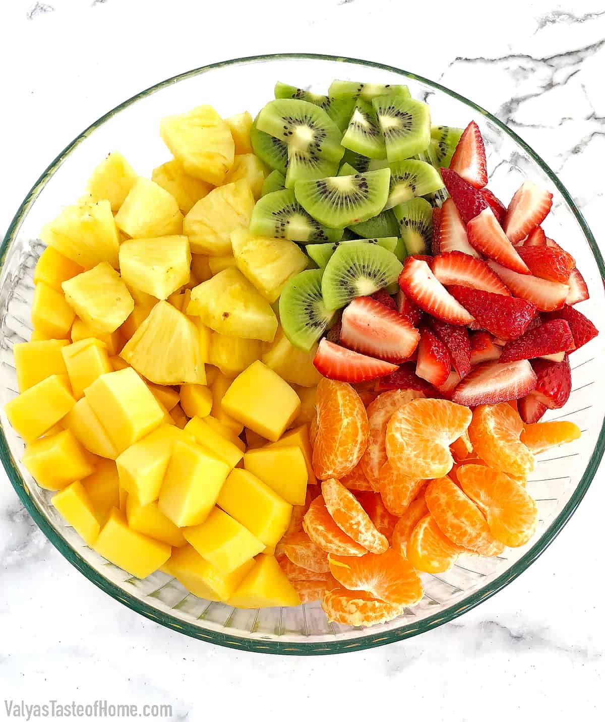 Rinse, pat dry, peel, and cut/slice all the fruits. Place them into a large bowl.