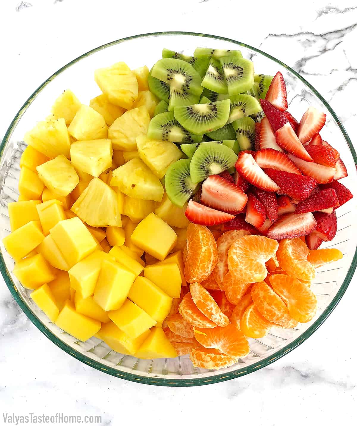 Rinse, pat dry, peel, and cut/slice all the fruits. Place them into a large bowl.