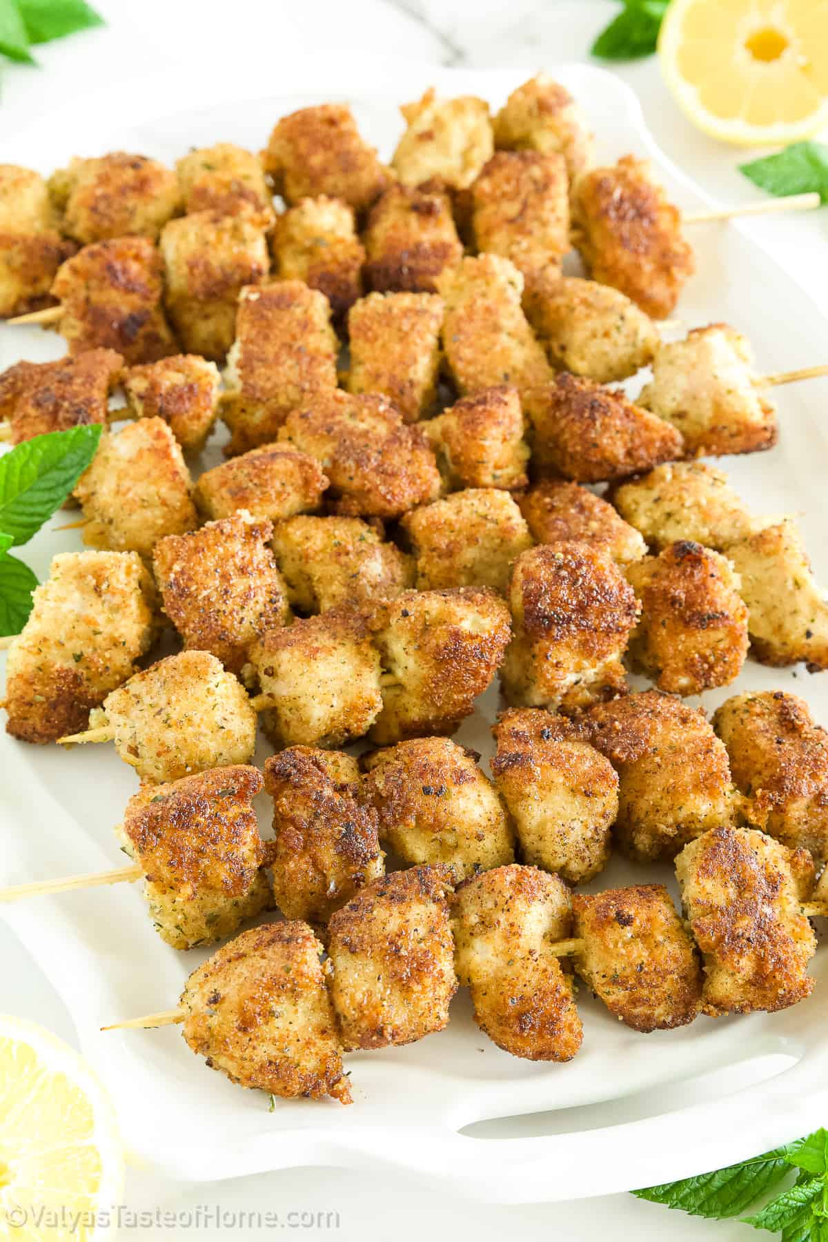 They’re delicious small chunks of chicken soaked in spices, mayo, and parmesan with a little zest of lemon juice!