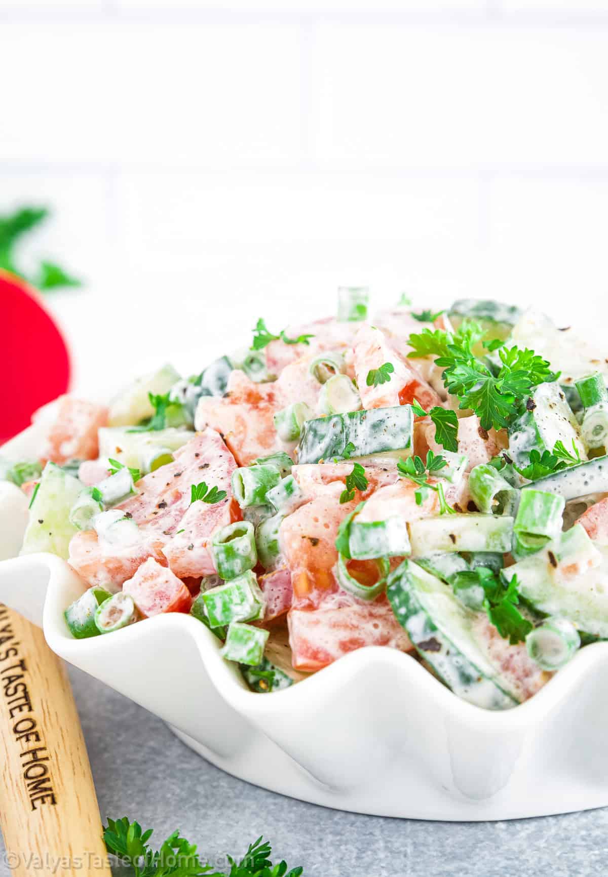 The combination of fresh cucumbers, ripe tomatoes, and a creamy dressing is a classic for a reason - it tastes amazing!