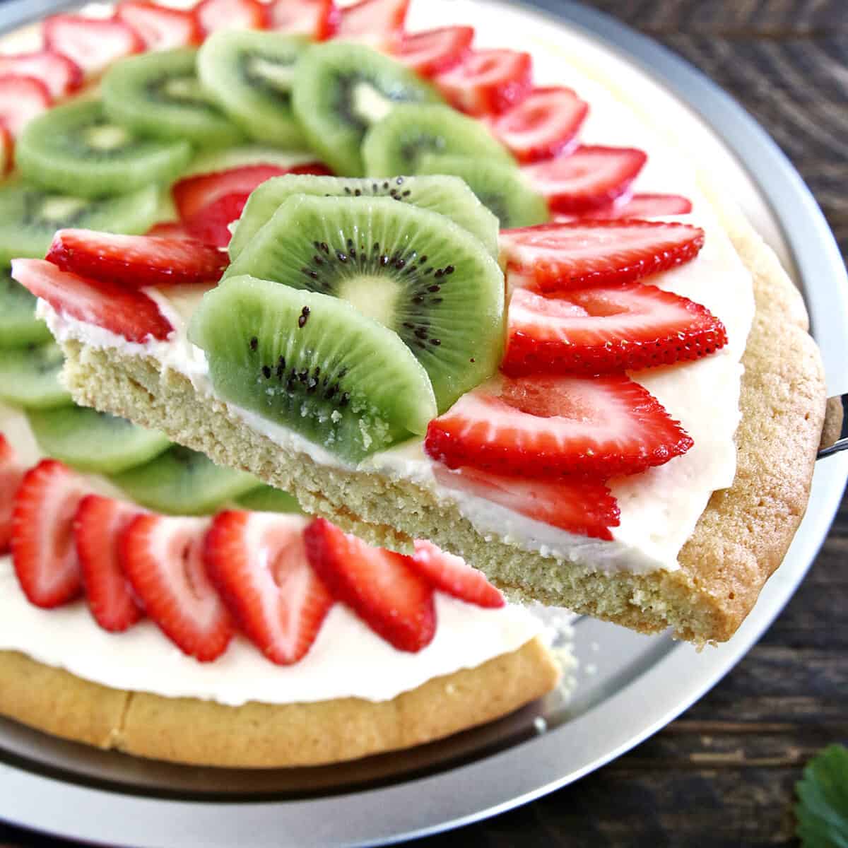 Another kid-friendly project is up again! Of course, there are lots of different fruit you can put on dessert pizza, but strawberry and kiwi is our family's absolute favorite combination, and this Strawberry Kiwi Dessert Pizza is my kid’s favorite dessert pizza.