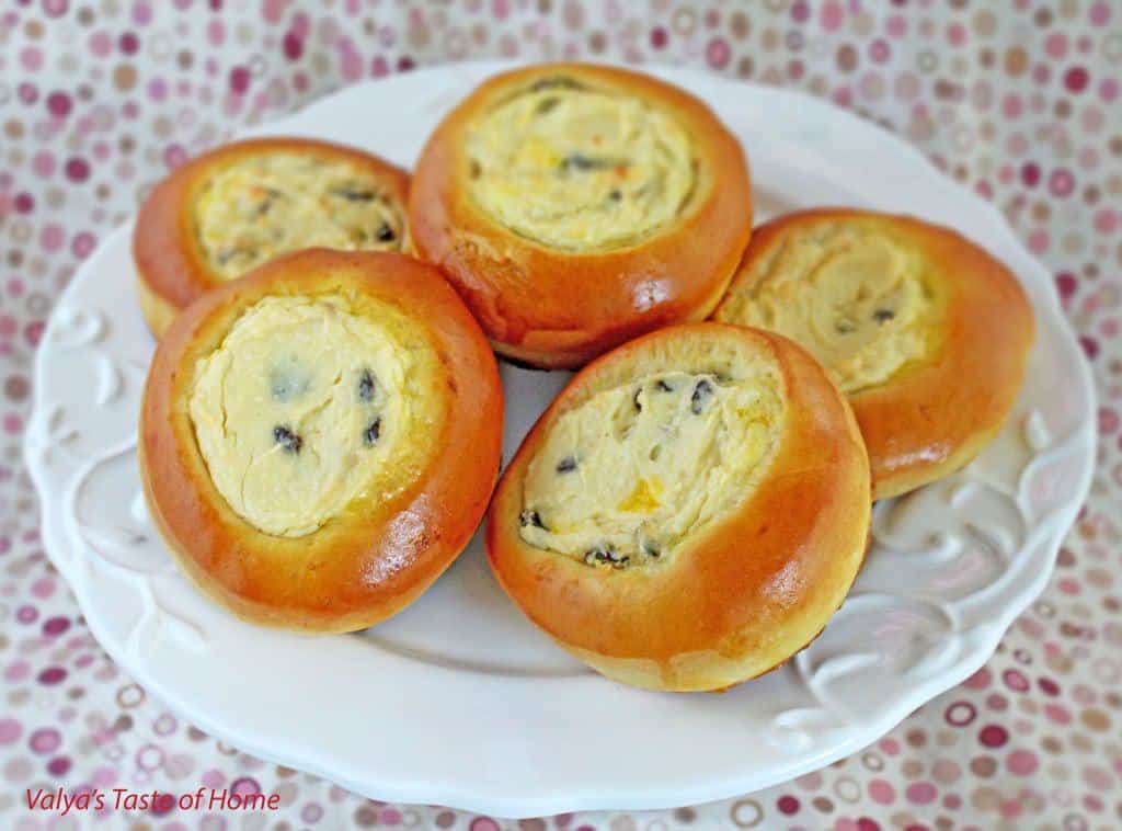 These Sweet Buns with Farmers Cheese and Raisins are made with a slightly sweet yeast dough that is topped with sweet farmer's cheese filling and is very popular in Eastern Europe.