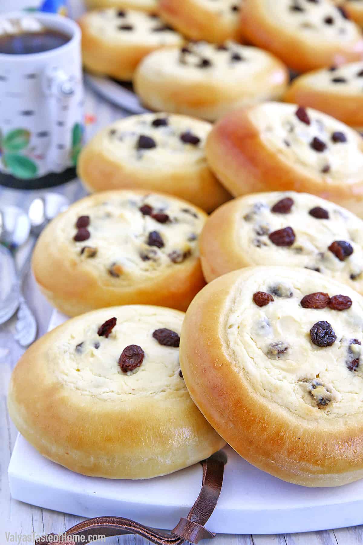 These Sweet Buns with Farmers Cheese and Raisins are made with a slightly sweet yeast dough that is topped with sweet farmer's cheese filling and is very popular in Eastern Europe.
