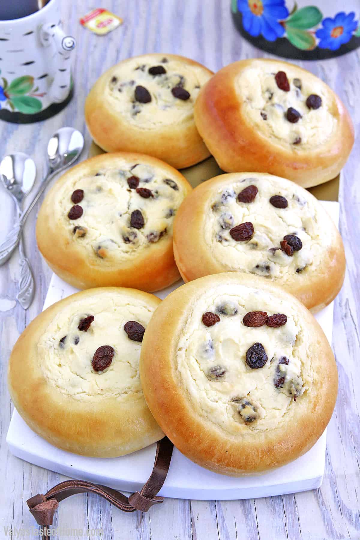 These Sweet Buns with Farmers Cheese and Raisins are made with a slightly sweet yeast dough that is topped with sweet farmer's cheese filling and is very popular in Eastern Europe.