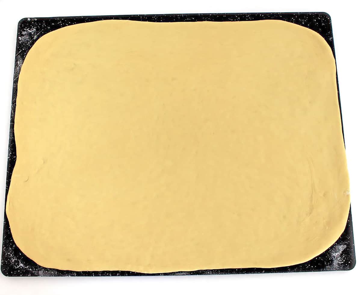 Roll out the first half of the dough into a large rectangle.