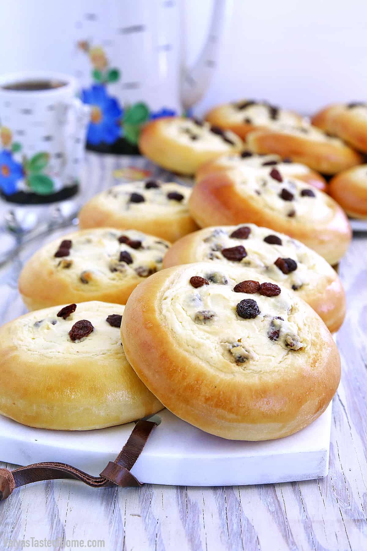 These Sweet Buns with Farmers Cheese and Raisins are made with a slightly sweet yeast dough that is topped with sweet farmer's cheese filling and is very popular in Eastern Europe.