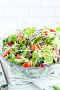 This salad is a total crowd-pleaser and is made with crisp romaine lettuce, fresh veggies, and a delicious salad dressing.