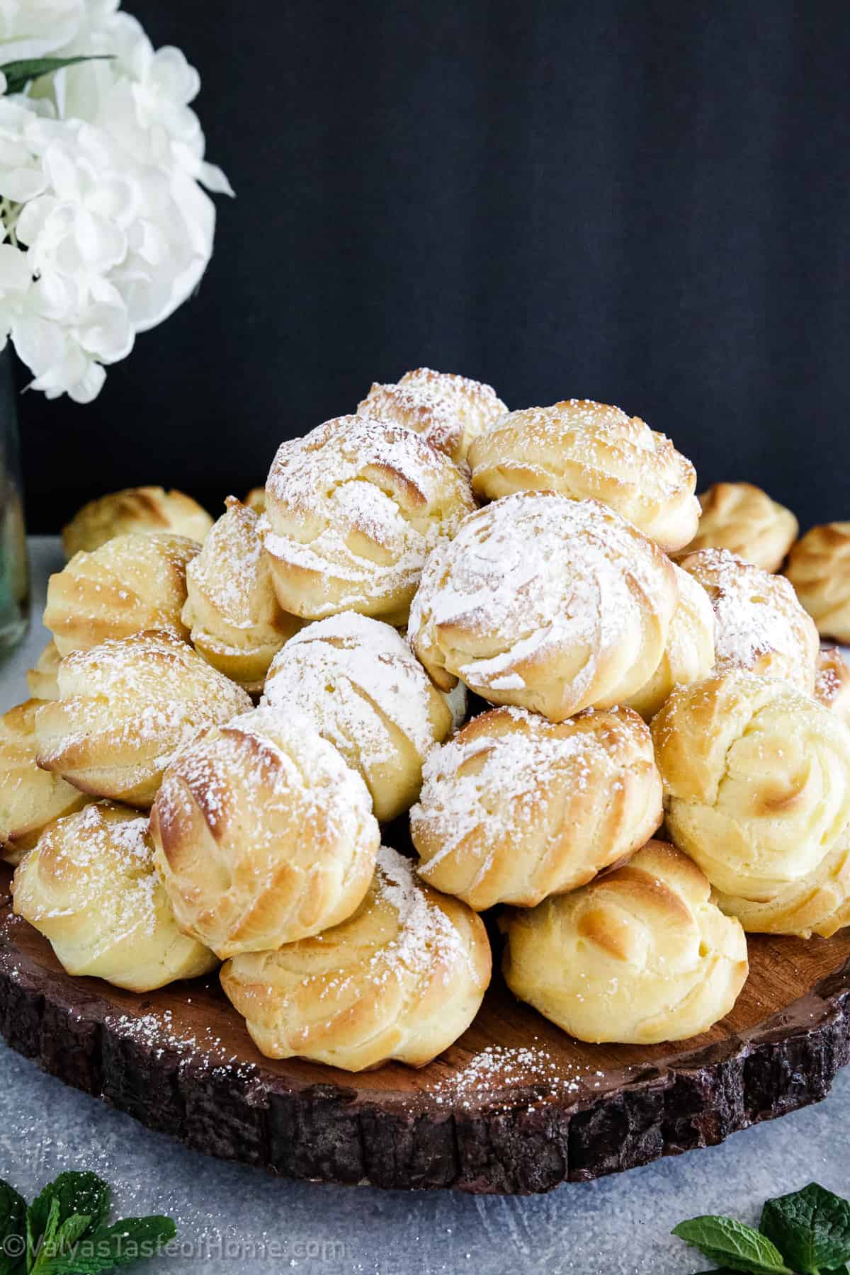 Cream puffs are a classic French dessert that are made by baking choux pastry dough (also known as pâte à choux) in small, round mounds.