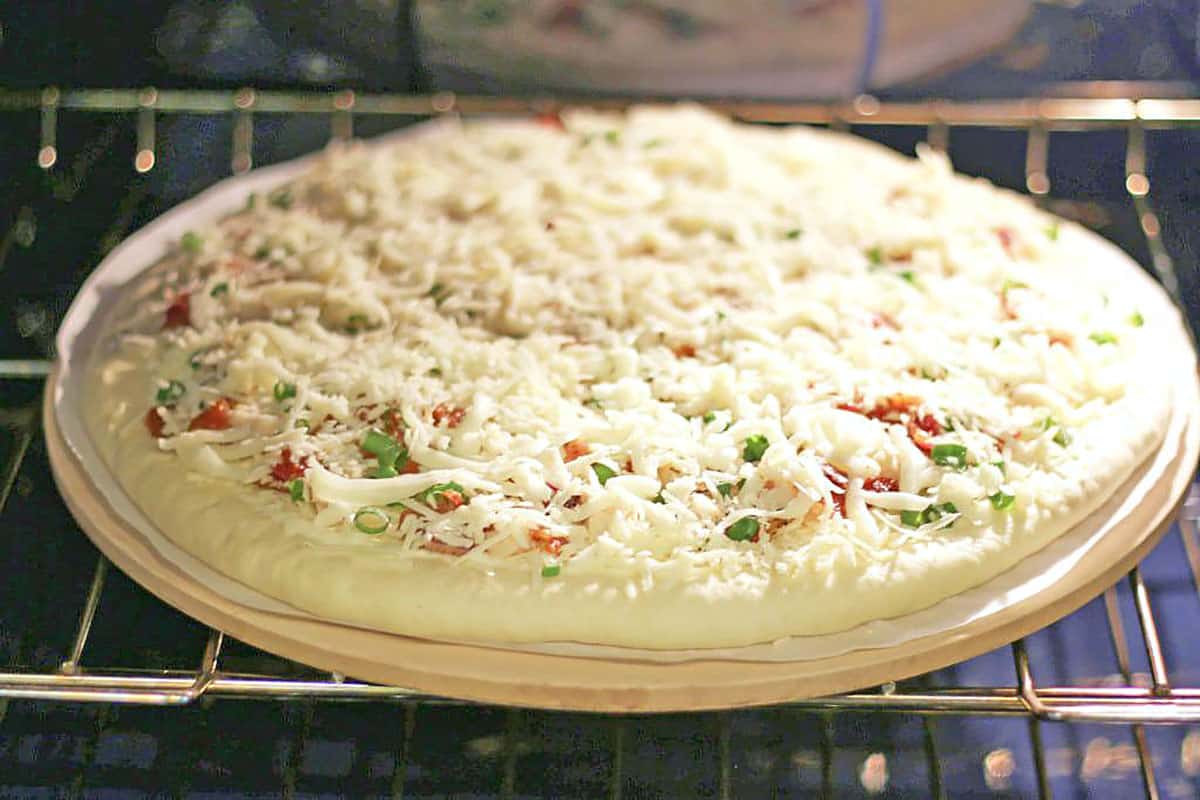 Let the pizza cool for 10 minutes before slicing as this prevents the cheese from sliding off pizza.