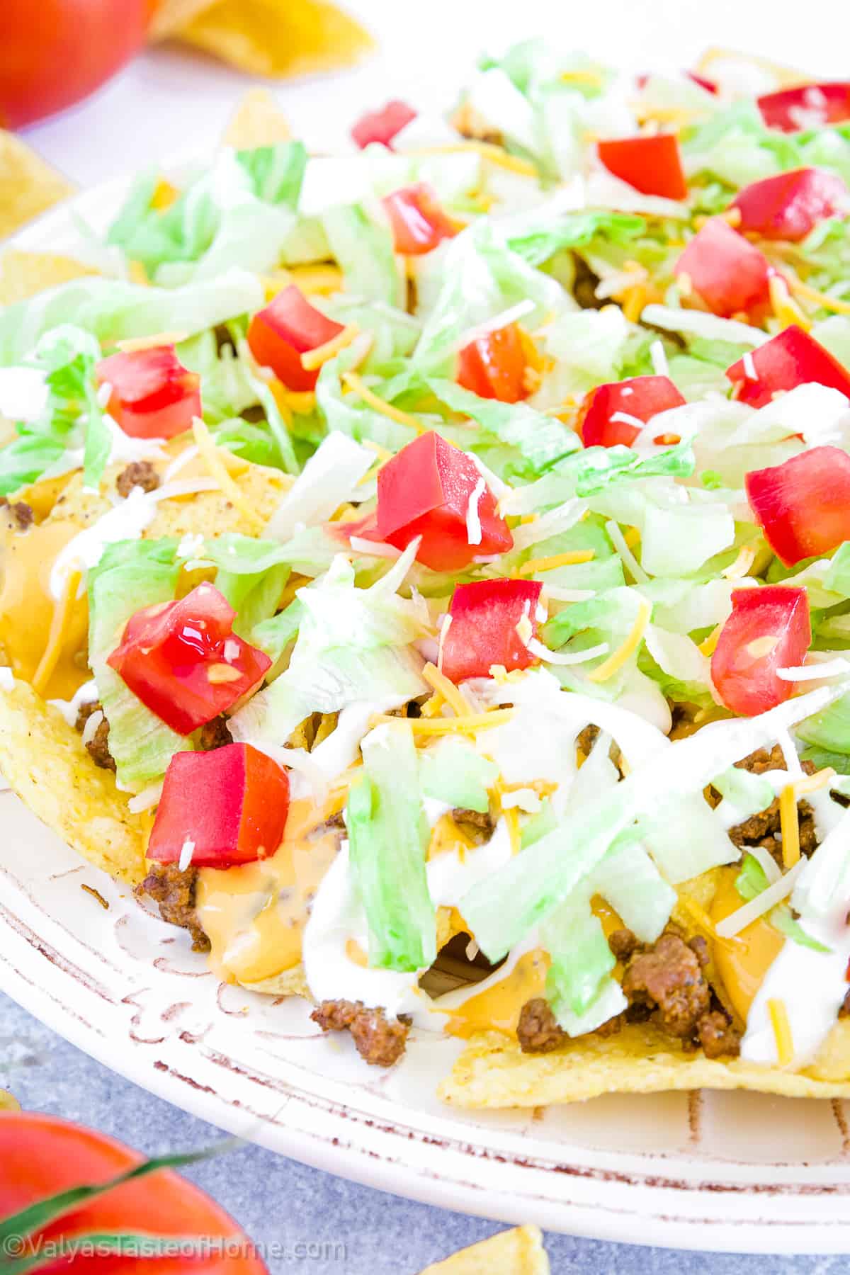 The crispiness of the nacho chips compliments the freshness of the lettuce, while the savory meat and creamy toppings add richness and depth.