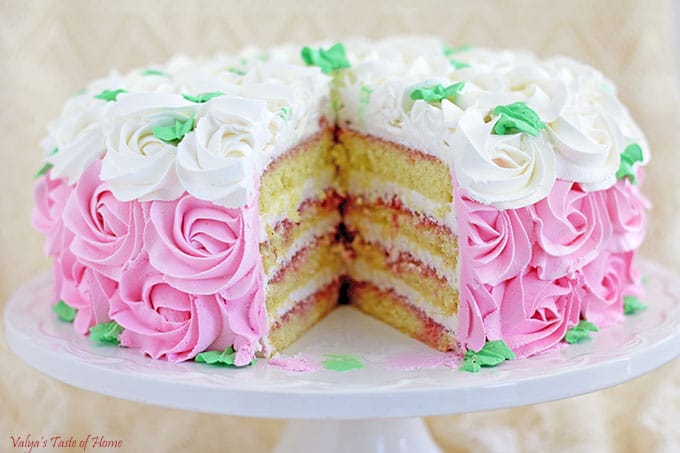 When assembling the cake, place a sponge on a cake stand. This will make it easier to apply the strawberry syrup and cream evenly.