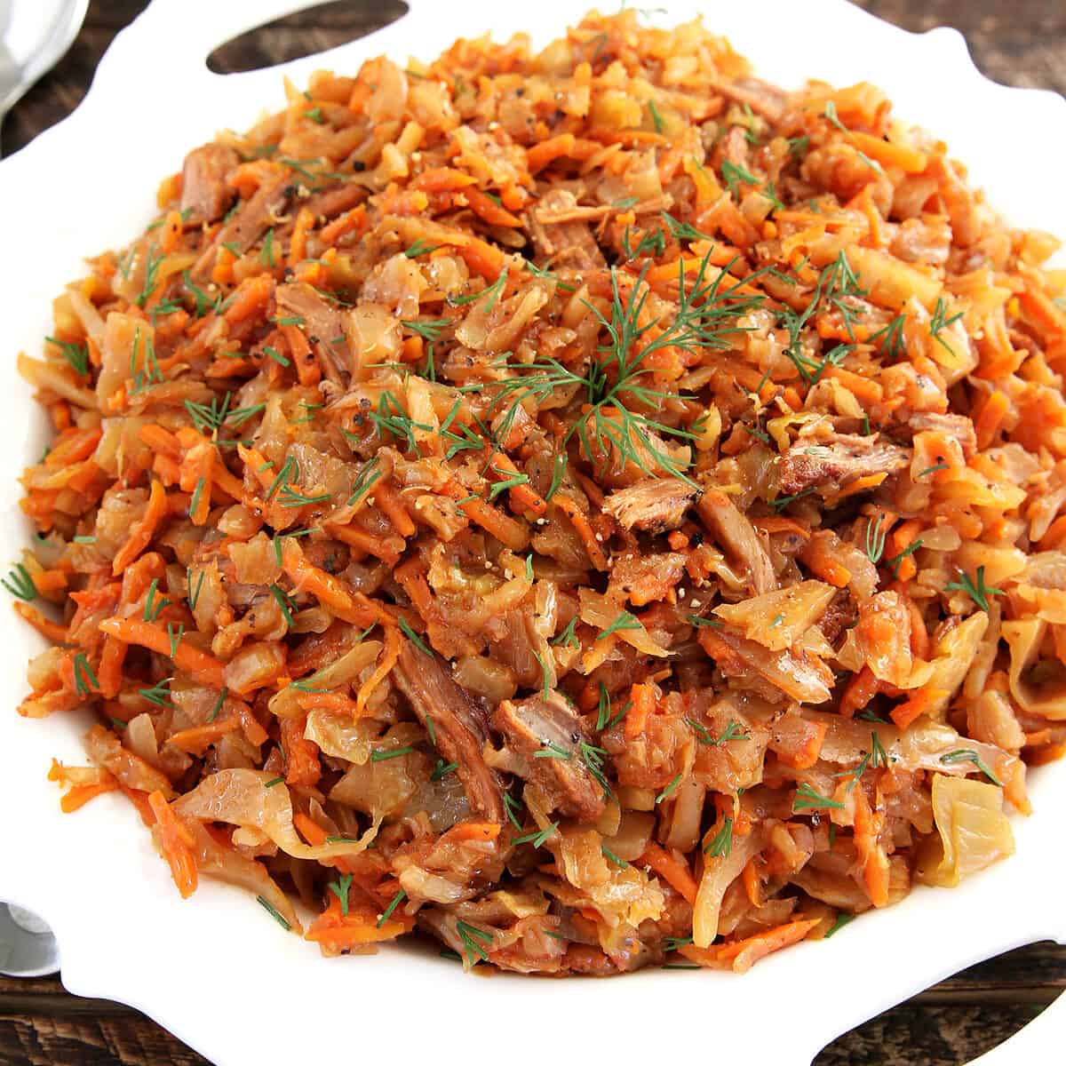 This Braised Cabbage with Beef is a very easy recipe to make but tastes so scrumptious and satisfying. It was a popular dish in Ukraine, as I was growing up. We had it pretty often during cabbage season and enjoyed it.