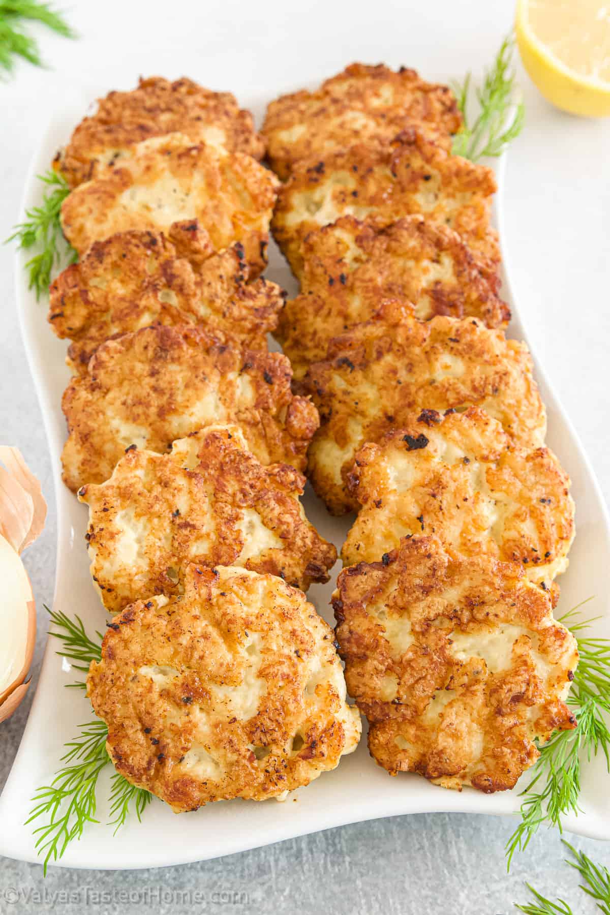 These Chicken Fritters are quick and easy to make and are crispy on the outside, and soft, juicy, and tender on the inside with a hint of garlic!