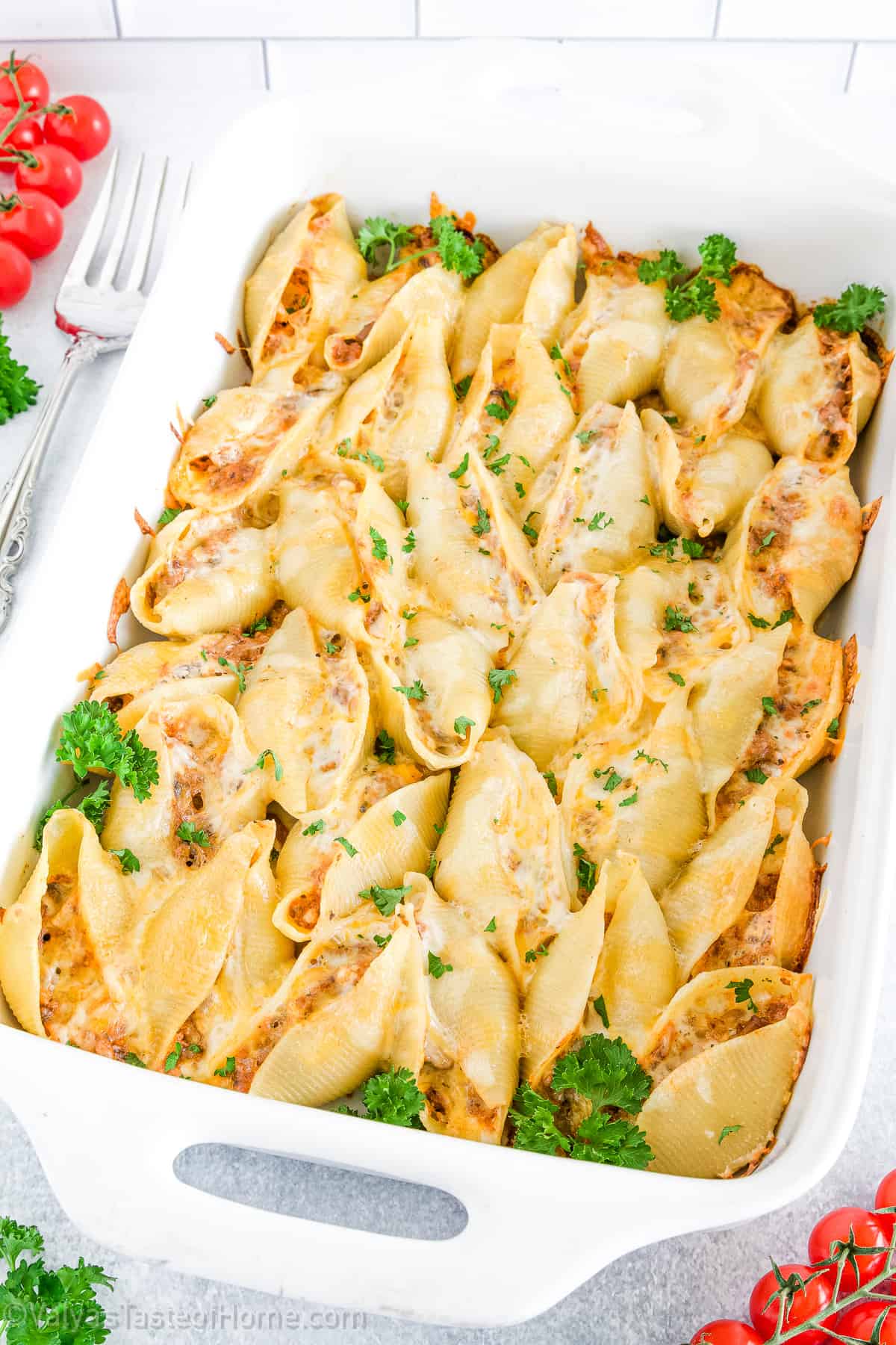This Stuffed Shells recipe features pasta shells filled with a mixture of ground beef, mushrooms and cheeses that's baked to perfection in a garlic pasta sauce.