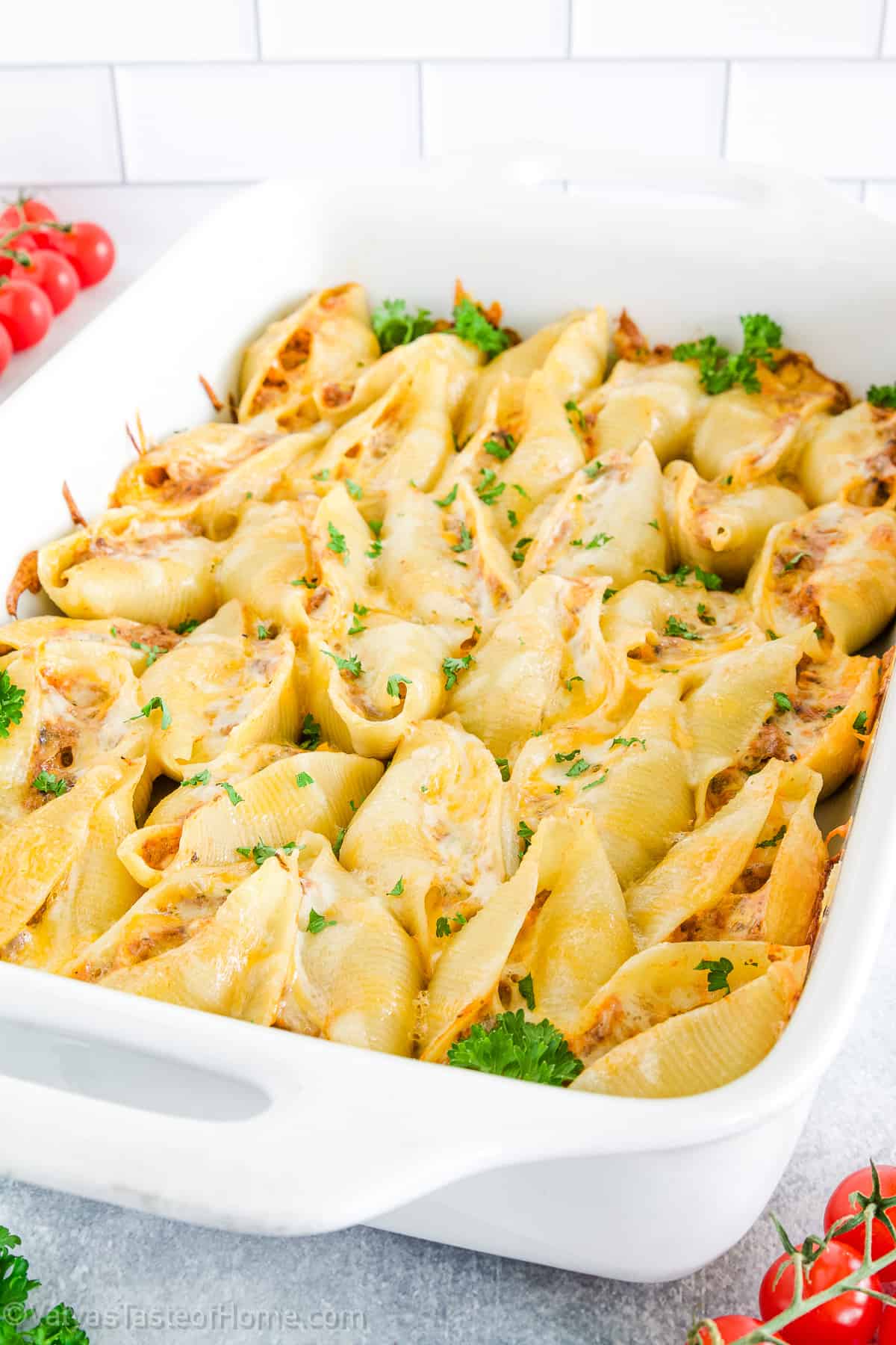 This Stuffed Shells recipe features that perfect stuffing! This delicious dish is made with soft pasta shells filled with a tasty mixture of ground beef, mushrooms, and a variety of cheeses, then baked to perfection in a rich roasted garlic pasta sauce.