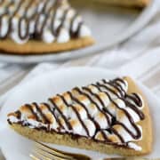 This S'mores Dessert Pizza crust is made out of the Easy Homemade Sugar Cookie Dough Recipe. The baked pizza tastes just like your typical S'mores. And it’s super easy to make!