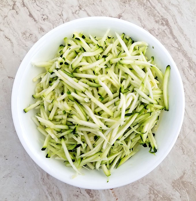 Grate the zucchini and set it aside.