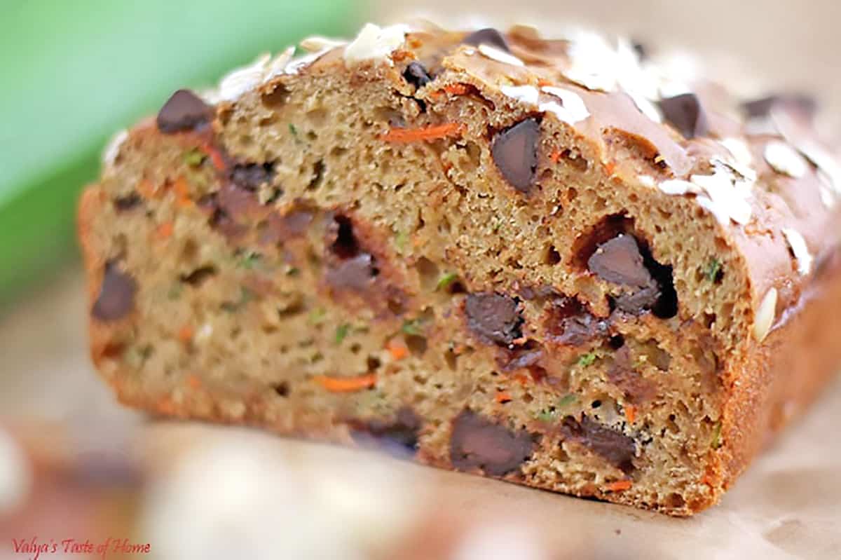 We are overloaded with carrots and zucchini in my garden this year. So, I thought I'd play with them and create some recipes. I literally tossed all ingredients together in just a few minutes is how this Greek Yogurt Carrot Zucchini Bread with Dark Chocolate Chip was created.