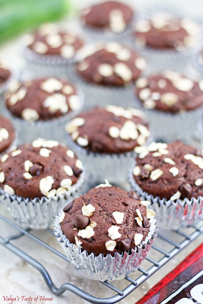 The addition of zucchini adds moisture to the muffins, making them soft and tender.