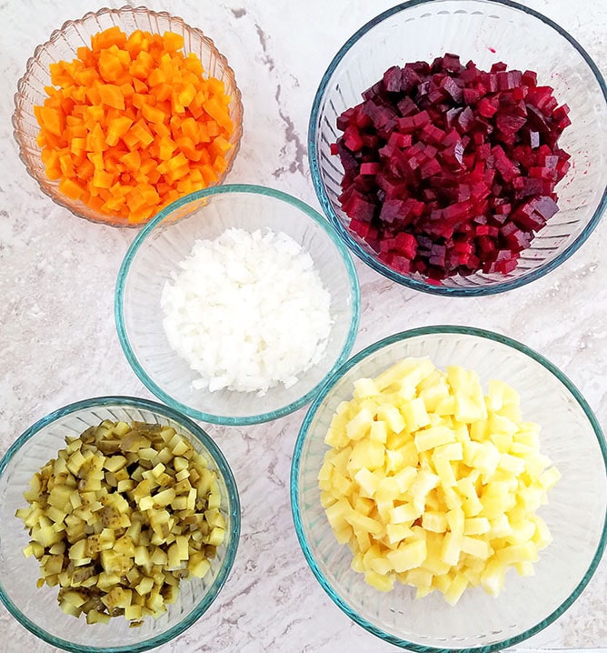 After cooked vegetables are cooled, peel the skin, dice vegetables, and then place all diced vegetables into one large bowl. Here, I’ve placed all diced vegetables into different bowls temporarily for better visibility.