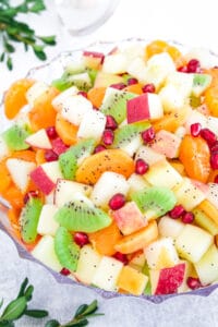 This recipe usually includes a vibrant mix of fruits like pears, apples, oranges, kiwi, and pomegranate seeds. The fruits are tossed in a homemade dressing, which is often a blend of citrus juices and sweeteners like honey or maple syrup.