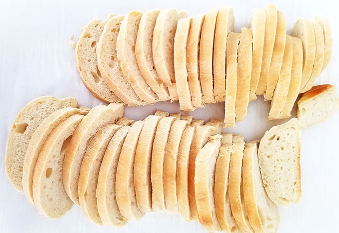 Start by slicing the bread loaf into thin slices.