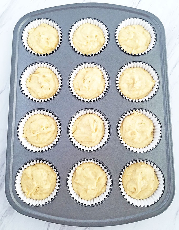 Distribute the batter evenly between 12 liners in a muffin pan.