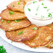 These golden-brown pancakes are made from grated potatoes, garlic, onions, and a few other ingredients, resulting in a dish that is both satisfying and comforting.