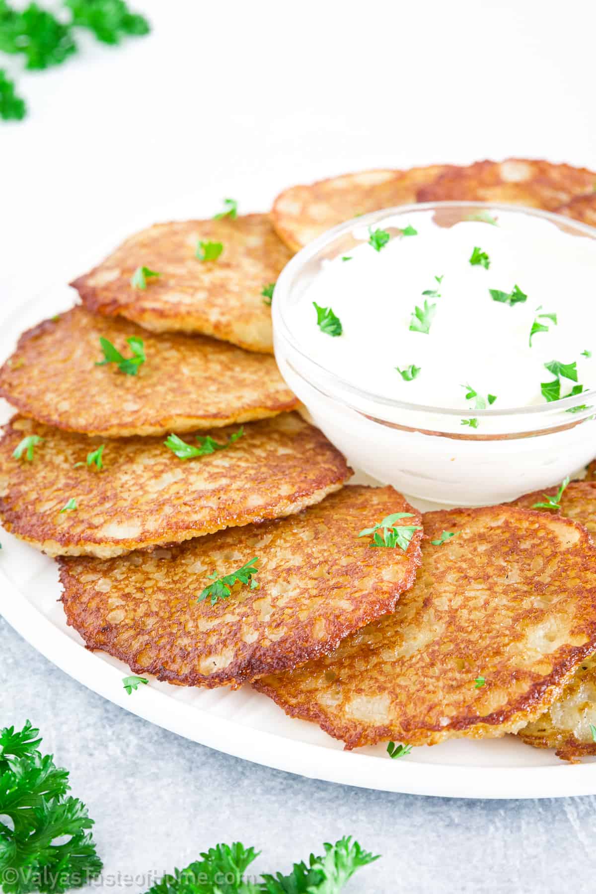 These golden-brown pancakes are made from grated potatoes, garlic, onions, and a few other ingredients, resulting in a dish that is both satisfying and comforting.