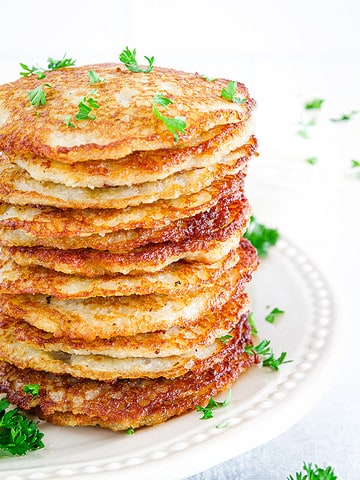 Potato pancakes, also known as draniki, are a traditional Slavic dish made from grated potatoes that are mixed with flour and seasonings, and then fried until crispy.