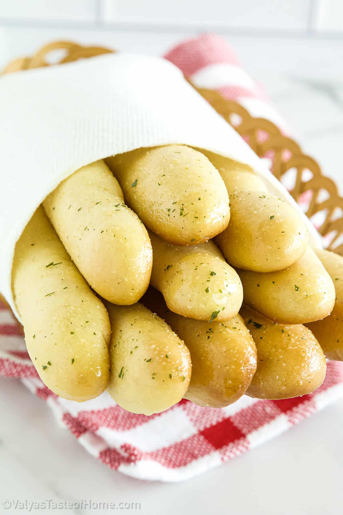 These homemade breadsticks are incredibly light, fluffy, and soft with the perfect crust but are easy to make from scratch.