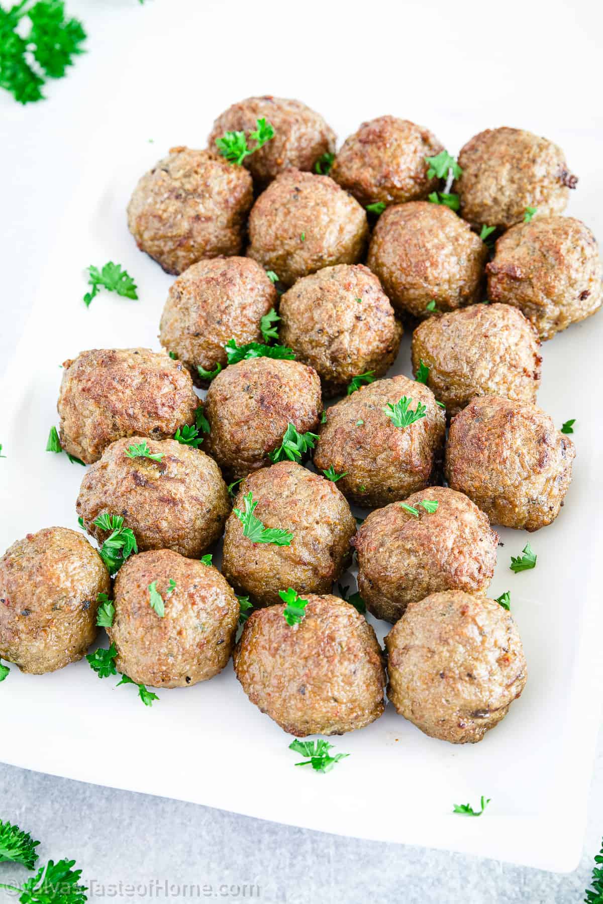 Once the meatballs are done baking and broiling, remove them from the oven and transfer them to a serving dish. 
